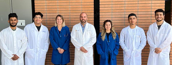 Dr. Nick Dipatrizio and six members of his lab staff