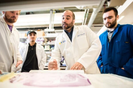dipatirizio and students in lab
